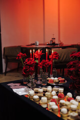 Beautiful decor at event, red candles is burning