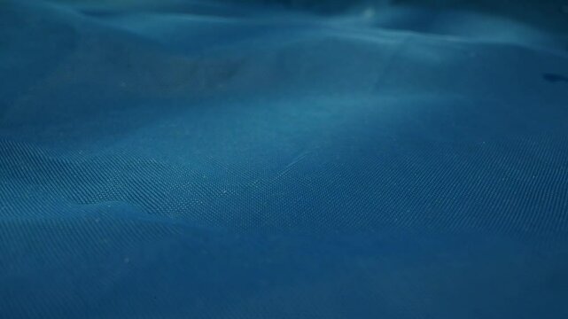 Tranquil Water Surface with Raindrops in Beautiful Blue Hues Captivating the Mind