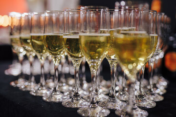 A row of champagne on the table