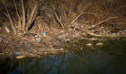 Garbage on the river. Pollution and waste trash in river, Toxic waste, Wastewater, Dirty water in...