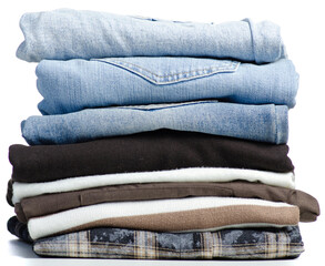 Folded brown white clothes shirt jeans stack on white background isolation