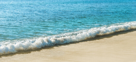 Soft wave of the sea on the sandy beach