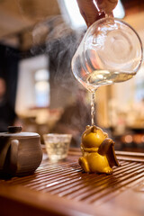 The Tea Ceremony Process is beautifully highlighted with exquisite pots and elegant glassware