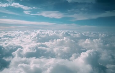 Serene Aerial View of Fluffy White Clouds and Vivid Blue Sky