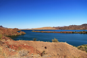 View of Lake Havasu and Colorado River near Lake Havasu City, Arizona, USA with view of California and blue sky copy space.