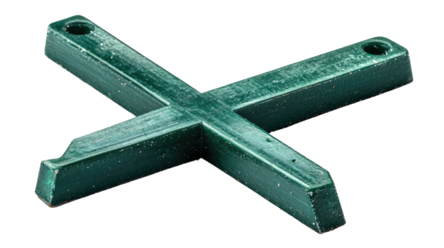Green Tile Spacer: A detailed close-up view of a green tile spacer, essential tool for achieving perfectly aligned tile installations
