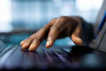 Technician in data center typing on laptop keyboard, developing disaster recovery plans. Close up of worker in server hub testing failover scenarios using notebook, protecting data during disruptions