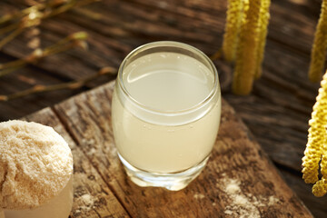 Fresh natural whey in a glass cup