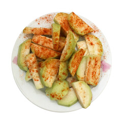 Sliced guava with red chili powder