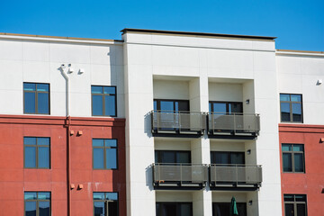 Residential apartment building facade with balconies and windows