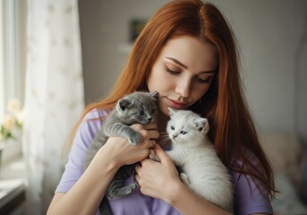 Young woman embraces two cute kittens in a cozy home setting