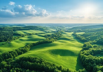 Fototapeta premium Lush Green Rolling Hills Under a Clear Sky with Soft Clouds and Sunlight Illuminating the Scenic Landscape of Serene Natural Beauty
