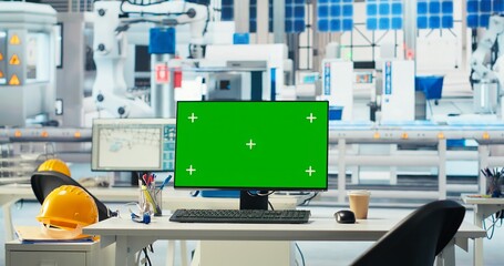 Isolated screen PC in empty solar panels manufacturing plant used to optimize layouts. Chroma key computer in photovoltaics factory used to do arrangements for maximum energy output