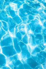 Obraz premium Sunlit blue water with ripple patterns creating serene aquatic texture