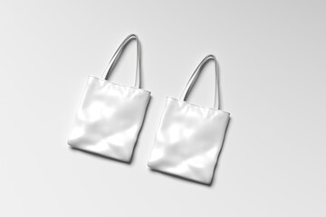 blank White tote bag mockup on a grey background.