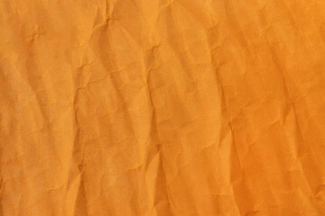 Abstract wrinkled orange crumpled paper texture background