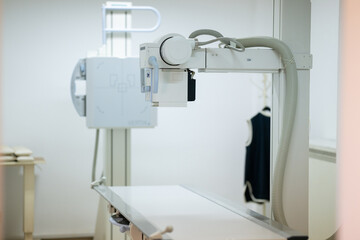 Modern X-ray machine in a medical examination room.