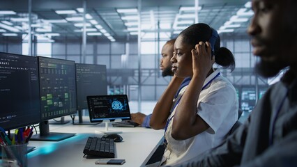 Data center engineer wearing headphones enjoying songs, maintaining company network infrastructure. Woman in server hub listening music while ensuring optimal system performance, camera A