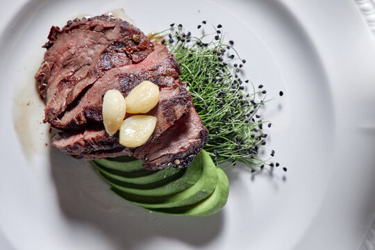 Ribeye steak with avocado.