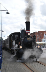 Vintage Steam Locomotive at Train Station