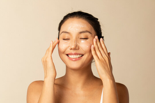 Woman Enjoys Giving Herself a Face Cleansing 