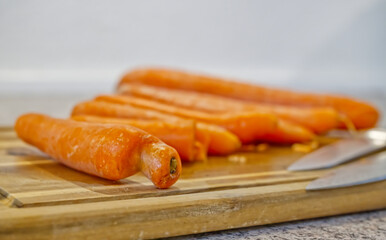 Fresh Carrots on a Wooden Cutting Board