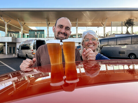 UGC mom and son in parking lot with beers