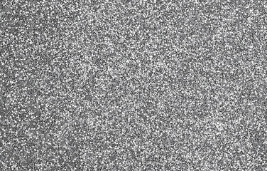 Fototapeta premium Silver glitter texture background with a shiny and sparkling effect, blending white and grey tones. The glittery surface creates a glamorous, textured background ideal for creative design projects.
