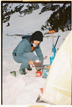 Woman making meal in the backcountry