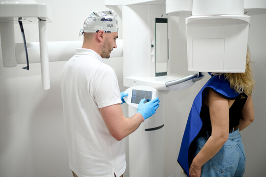 woman doing teeth roentgen at light medical clinic