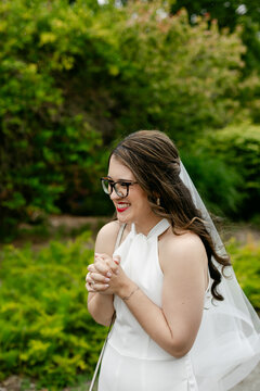 Smiling Bride Claps Her Hands with Excitement