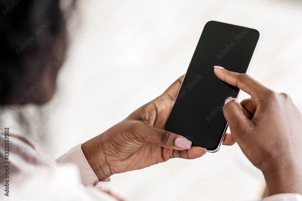 Leinwandbilder unrecognizable african american female browsing smartphone with black screen, checking new app or sc