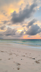Sunset on the beach. Beautiful tranquil scene of empty sand beach, turquoise colored water, and cloudy sky, cinematic. with white shades