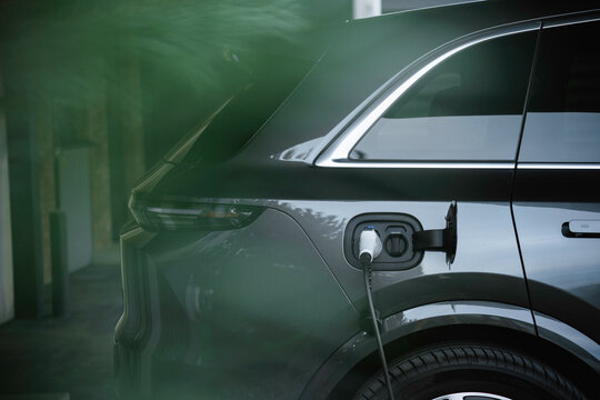 The cable is connected to the electric car