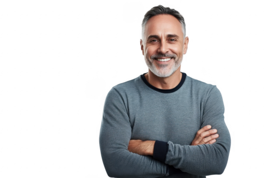 PNG studio portrait of a mature man standing with his arms folded against a grey background 
