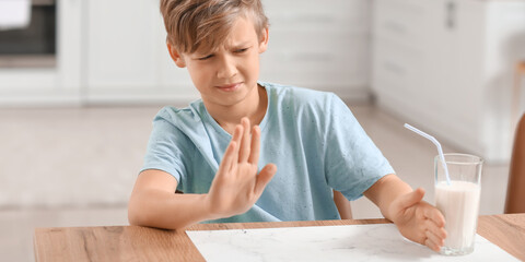 Little boy with dairy allergy in kitchen