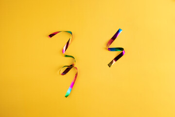 Festive Ribbons on Yellow Background