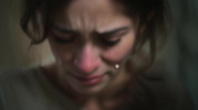 The girl crying in the corner felt overwhelmed by her emotions, seeking comfort and understanding.