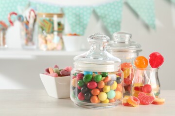 Candy bar. Many different sweets on white table indoors, closeup. Space for text