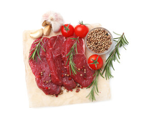 Pieces of raw beef meat, spices and tomatoes isolated on white, top view