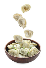 Tasty boiled dumplings (pelmeni) falling into bowl against white background