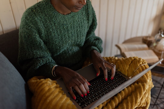  Woman typing on laptop keyboard