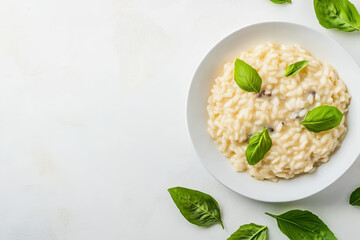 Luxurious flat-lay of gourmet mushroom risotto with truffle oil adorned with fresh basil leaves for a culinary delight
