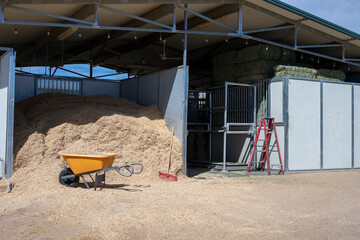 A wood shaving and hay in a ranch storage facility