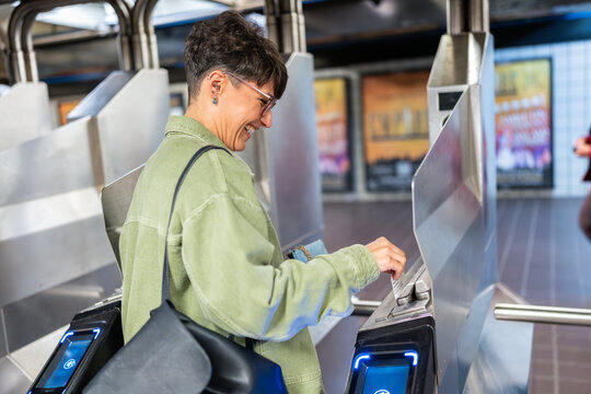 Woman entering New York City Subway using OMNY contactless