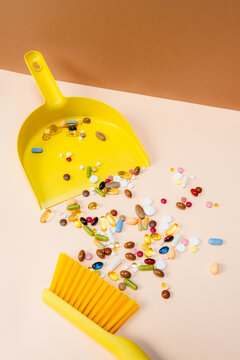 The brush sweeps the pills into a scoop