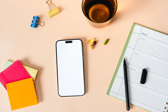 A mobile phone with white screen on the desktop