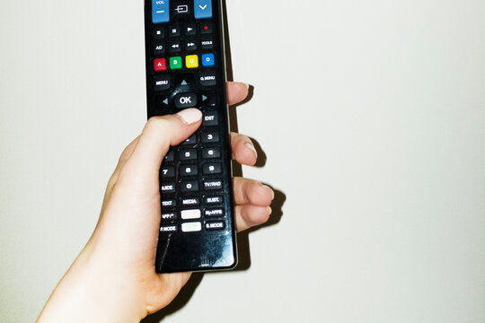 Pov/point of view of person switching on and watching tv television 