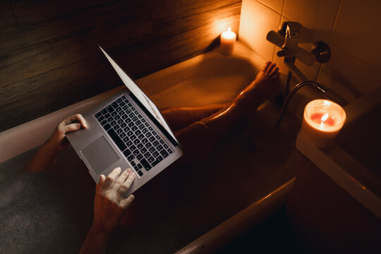 Relaxing time in hot bathtub with candlelight