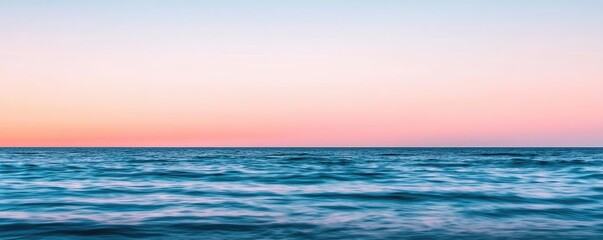 Obraz premium Seascape abstract background idea. A serene ocean view at dusk, showcasing tranquil waters and a pastel sky.